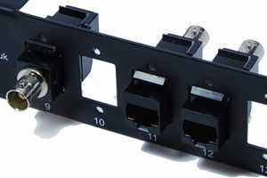 [Photo of Single Balun Adapter mounted in a combination panel]